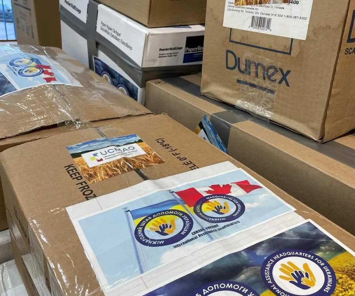 Boxes of donated medical supplies labelled with UCMAO stickers, ready for shipment to Ukraine